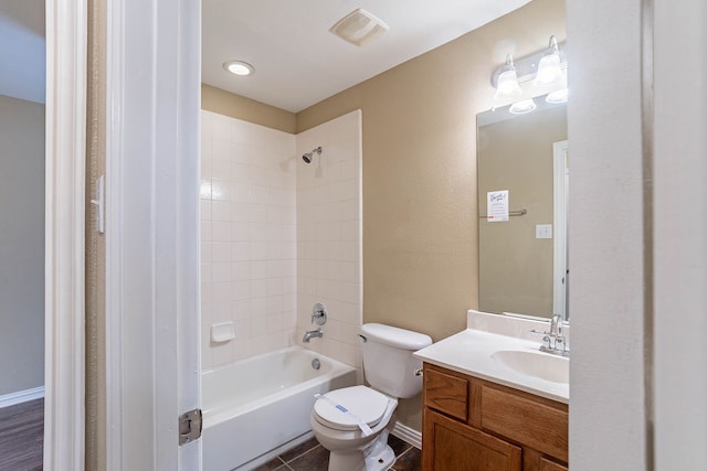 7001 Bickers Dr, Rowlett, TX 75089 - bathroom featuring vanity, toilet, and shower / bathtub combination