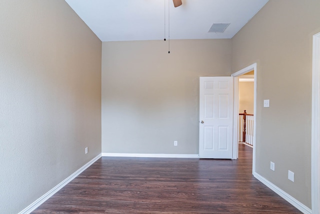 7001 Bickers Dr, Rowlett, TX 75089 - spare room with dark wood-style floors, baseboards, and ceiling fan