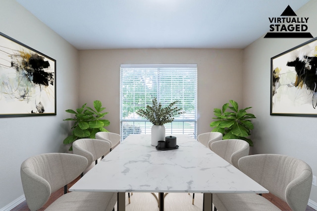 7001 Bickers Dr, Rowlett, TX 75089 - dining area featuring baseboards