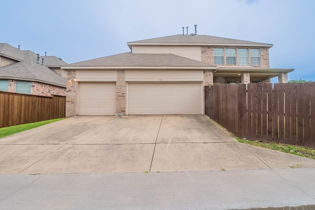 7001 Bickers Dr, Rowlett, TX 75089 - traditional-style home with a garage, concrete driveway, and brick siding