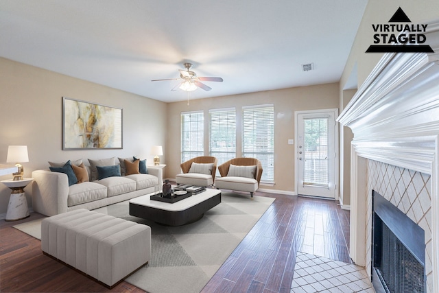 7001 Bickers Dr, Rowlett, TX 75089 - living area featuring a fireplace, a ceiling fan, wood finished floors, and baseboards
