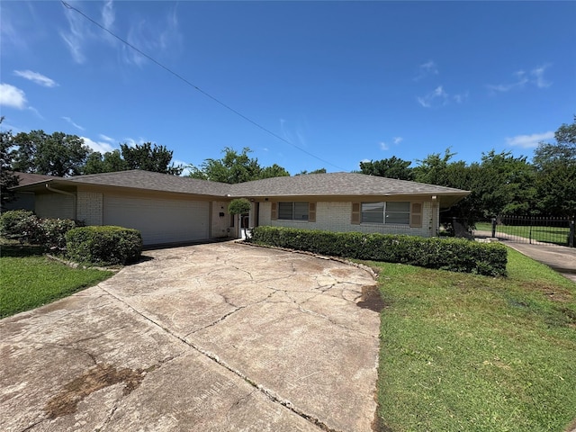 1605 NE 17th, Paris, TX 75460 - single story home featuring brick siding, concrete driveway, and an attached garage