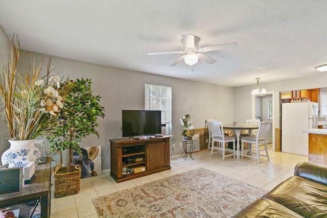 813 Pine St, Teague, TX 75860 - living area featuring light tile patterned floors and ceiling fan