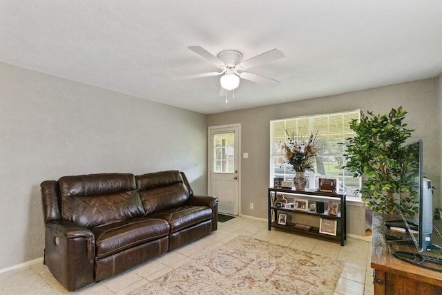 813 Pine St, Teague, TX 75860 - living room with a ceiling fan and light tile patterned floors