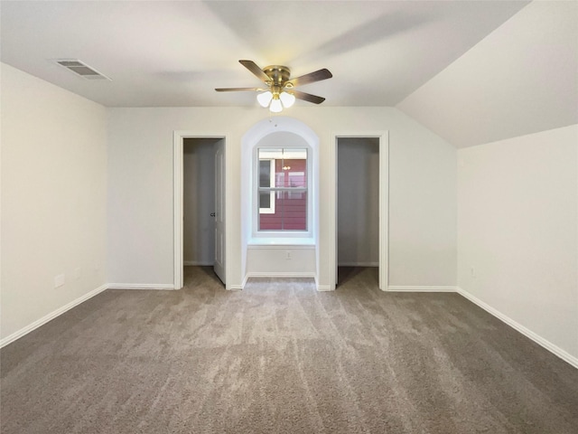 9903 Cedarcrest Dr, Providence Village, TX 76227 - unfurnished bedroom with carpet, multiple closets, lofted ceiling, and a ceiling fan