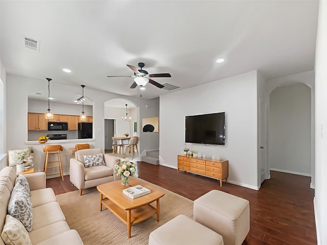9903 Cedarcrest Dr, Providence Village, TX 76227 - living room with arched walkways, a ceiling fan, recessed lighting, wood finished floors, and baseboards