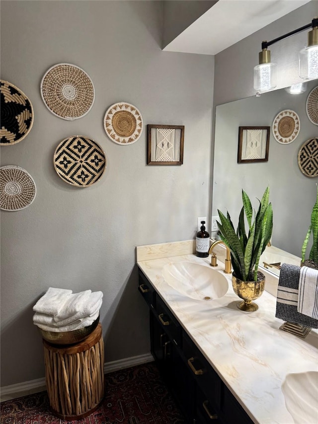 3904 Davis Cir, Plano, TX 75023 - bathroom with double vanity and baseboards