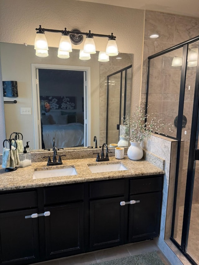 5001-5003 Sanger Circle Dr, Sanger, TX 76266 - ensuite bathroom featuring double vanity, a shower stall, and tile patterned floors