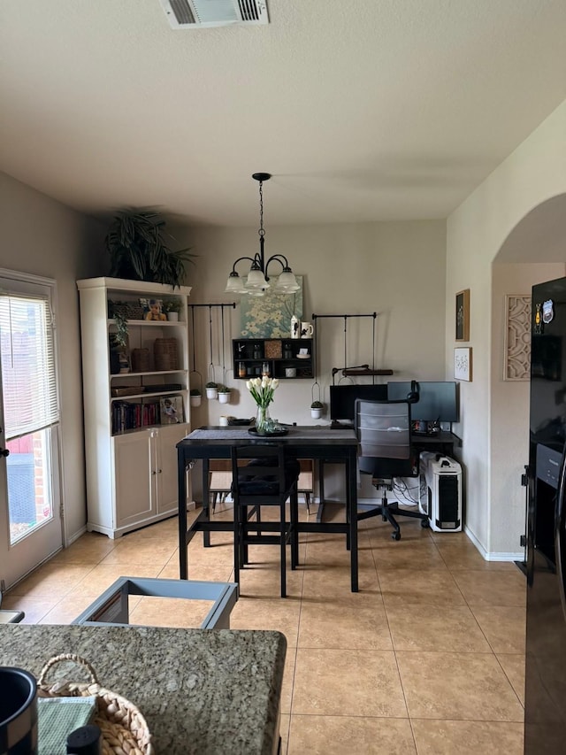 5001-5003 Sanger Circle Dr, Sanger, TX 76266 - dining space featuring light tile patterned flooring, a chandelier, and baseboards