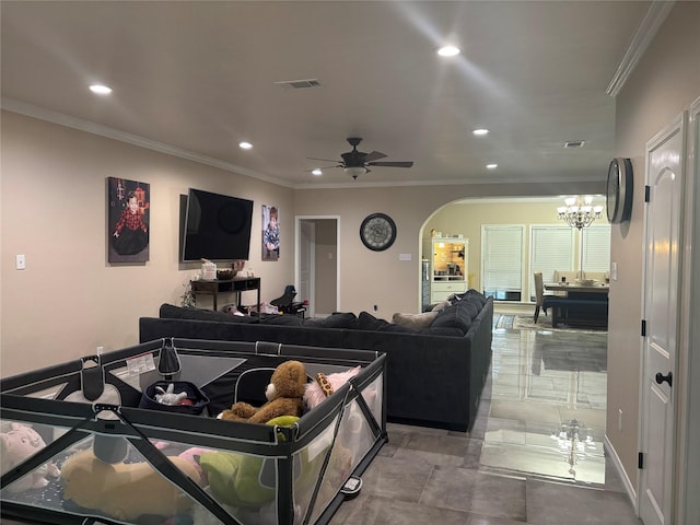 3307 Shawnee Trl, Lake Worth, TX 76135 - living room featuring arched walkways, recessed lighting, ceiling fan, ornamental molding, and a chandelier