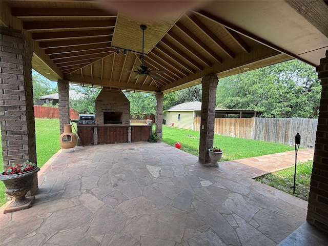 3307 Shawnee Trl, Lake Worth, TX 76135 - view of patio / terrace with an outdoor brick fireplace and ceiling fan