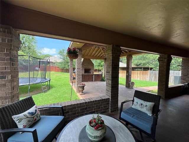 3307 Shawnee Trl, Lake Worth, TX 76135 - view of patio / terrace with an outdoor fireplace, a trampoline, and outdoor dining space