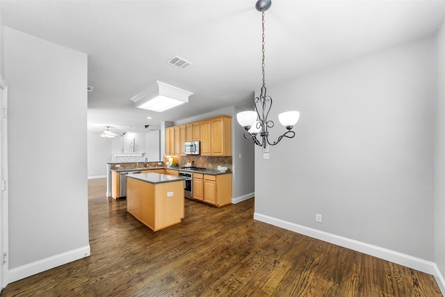 1557 Crystal Pass, Allen, TX 75002 - kitchen with stainless steel appliances, a chandelier, a center island, backsplash, and dark countertops