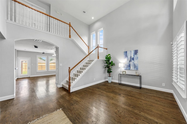1557 Crystal Pass, Allen, TX 75002 - foyer with a high ceiling, stairs, wood finished floors, and arched walkways