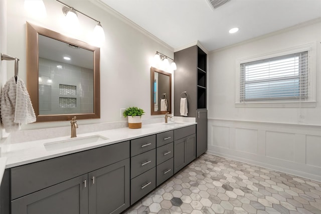 2225 Wooded Acres Dr, Waco, TX 76710 - bathroom with double vanity, ornamental molding, wainscoting, a decorative wall, and recessed lighting