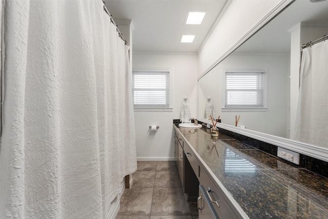 2225 Wooded Acres Dr, Waco, TX 76710 - full bath featuring double vanity, crown molding, plenty of natural light, and tile patterned floors