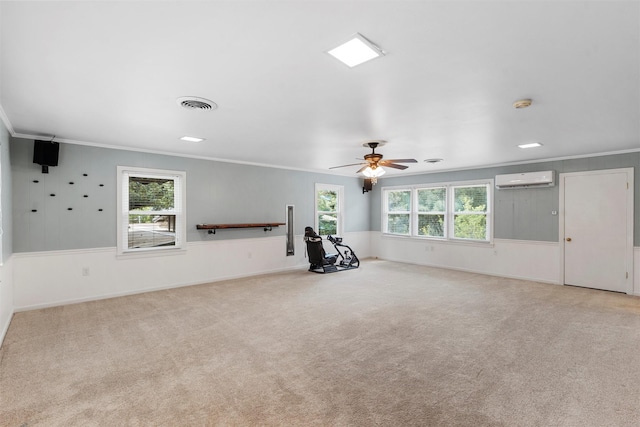 2225 Wooded Acres Dr, Waco, TX 76710 - unfurnished room featuring crown molding, a ceiling fan, a wall mounted AC, and carpet flooring