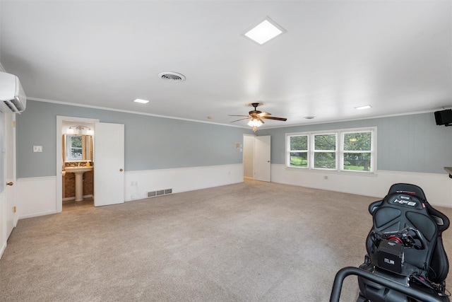 2225 Wooded Acres Dr, Waco, TX 76710 - unfurnished living room featuring a wall mounted air conditioner, ceiling fan, carpet floors, ornamental molding, and a wainscoted wall