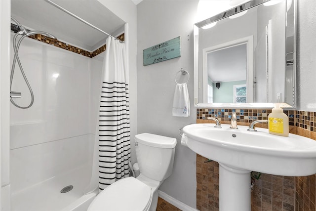 2225 Wooded Acres Dr, Waco, TX 76710 - bathroom featuring curtained shower and tasteful backsplash