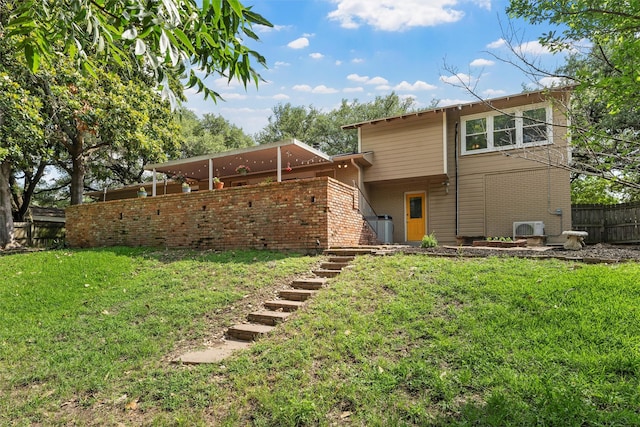 2225 Wooded Acres Dr, Waco, TX 76710 - back of property featuring brick siding and stairway