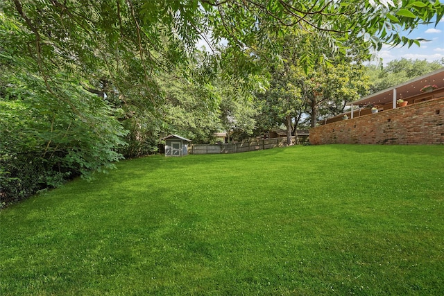 2225 Wooded Acres Dr, Waco, TX 76710 - view of yard with a storage unit