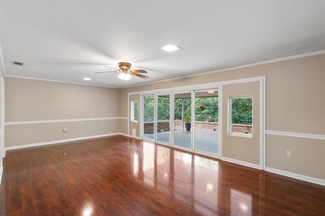 2225 Wooded Acres Dr, Waco, TX 76710 - empty room featuring wood finished floors, a ceiling fan, and ornamental molding