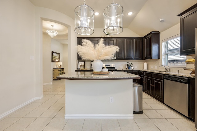 1926 Successful Dr, Wylie, TX 75098 - kitchen with stainless steel appliances, lofted ceiling, a sink, light stone counters, and light tile patterned flooring