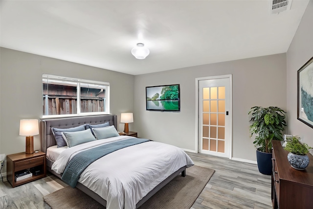 1510 Bowie St, Garland, TX 75042 - bedroom with light wood-type flooring and baseboards