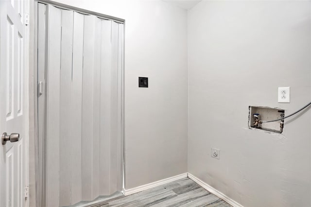 1510 Bowie St, Garland, TX 75042 - laundry room featuring hookup for an electric dryer, washer hookup, and light wood-style flooring