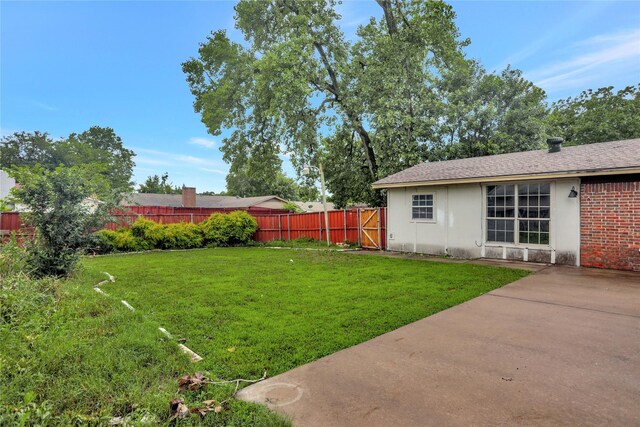 1510 Bowie St, Garland, TX 75042 - fenced backyard with a patio