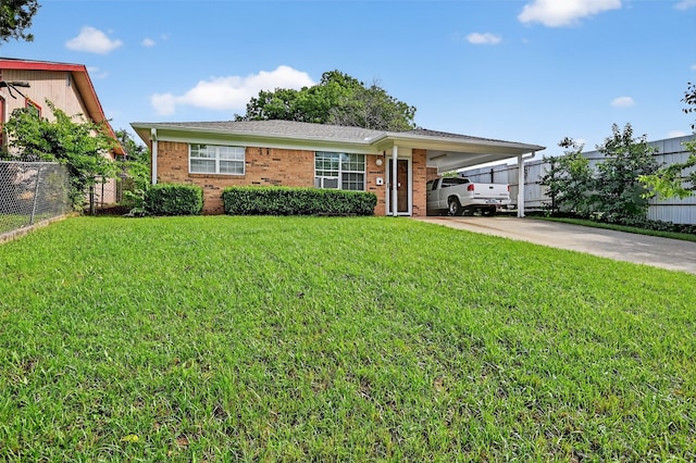 815 W Hull St, Denison, TX 75020 - view of front of home featuring driveway, a carport, and brick siding