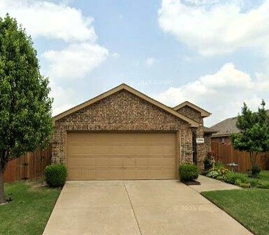 4036 Merriman Dr, Forney, TX 75126 - view of front of home with concrete driveway, a garage, and brick siding