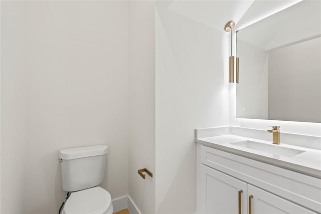 601 S Moore St, Dallas, TX 75203 - half bath with toilet, vanity, and baseboards