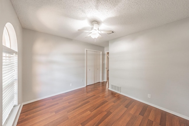 708 Simpson Ter, Bedford, TX 76021 - unfurnished room with a ceiling fan, wood finished floors, a textured ceiling, and baseboards