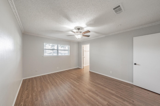 708 Simpson Ter, Bedford, TX 76021 - empty room featuring a textured ceiling, ornamental molding, wood finished floors, a ceiling fan, and baseboards
