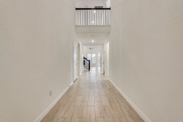 454 Lone Star Dr, Justin, TX 76247 - hall featuring light wood-style flooring and a high ceiling