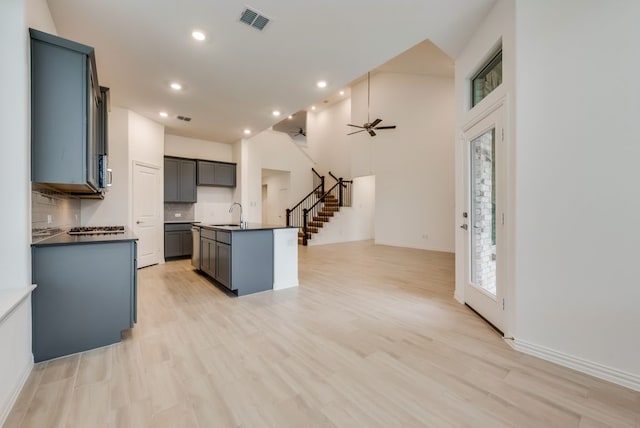 454 Lone Star Dr, Justin, TX 76247 - kitchen featuring dark countertops, decorative backsplash, open floor plan, recessed lighting, and ceiling fan