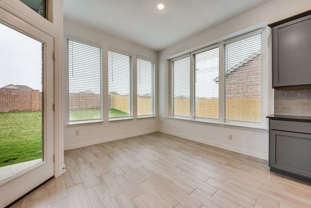 454 Lone Star Dr, Justin, TX 76247 - unfurnished sunroom featuring baseboards