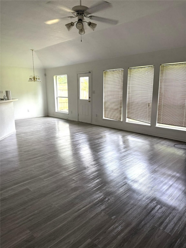 334 River Oaks Ln, Canton, TX 75103 - unfurnished living room featuring lofted ceiling, ceiling fan, dark wood-style floors, and a chandelier