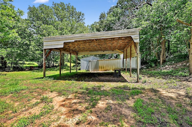 344 Trail Rd, Denison, TX 75021 - view of yard featuring a carport and an outbuilding