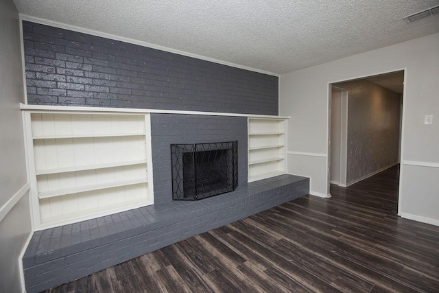 4209 W Pleasant Forest St, Arlington, TX 76015 - unfurnished living room featuring a textured ceiling, wood finished floors, a fireplace, and built in features