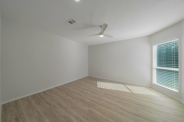1109 Mill Spgs, Richardson, TX 75080 - empty room featuring light wood-style flooring, a ceiling fan, and baseboards