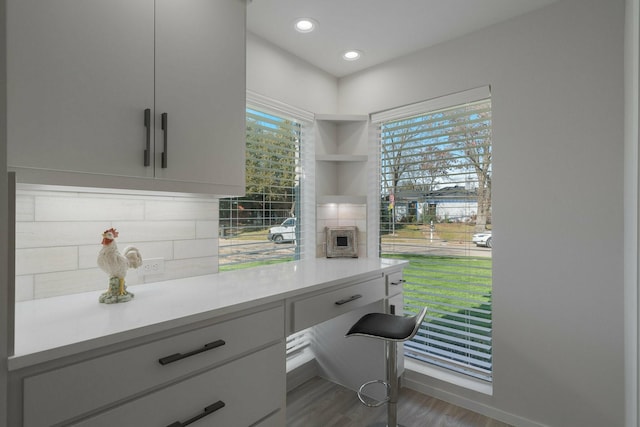 1109 Mill Spgs, Richardson, TX 75080 - kitchen featuring light countertops, wood finished floors, recessed lighting, baseboards, and decorative backsplash
