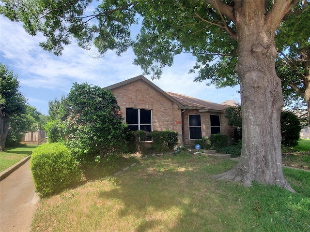 4109 Crystal Ln, Garland, TX 75043 - view of front of home with brick siding and a front yard
