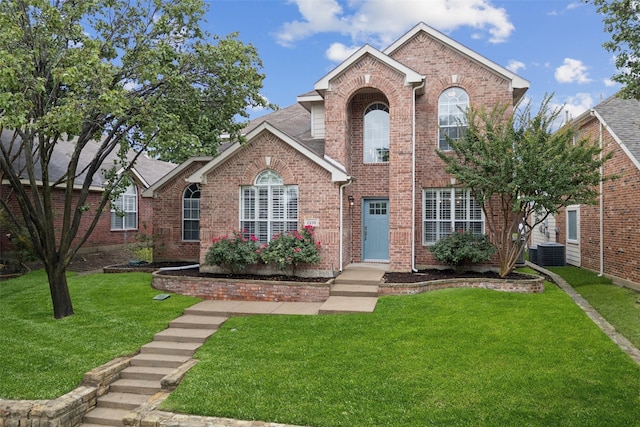 2210 Garden Crest Dr, Rockwall, TX 75087 - traditional-style house with brick siding and a front yard