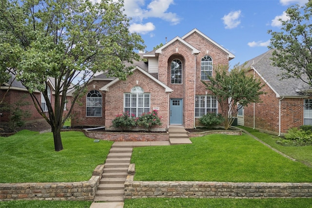 2210 Garden Crest Dr, Rockwall, TX 75087 - traditional-style home featuring brick siding and a front yard