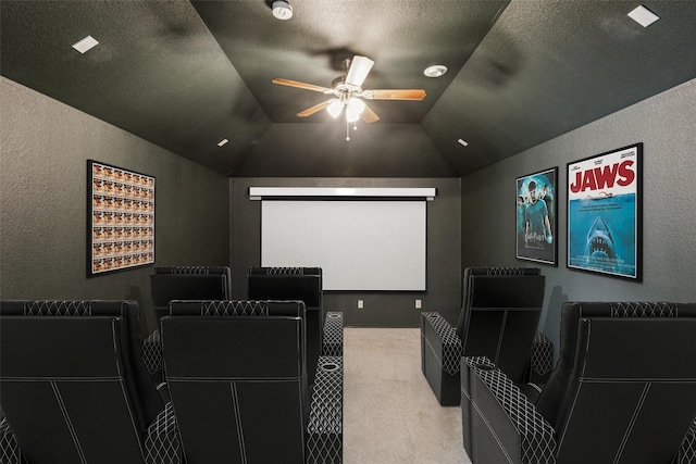 2210 Garden Crest Dr, Rockwall, TX 75087 - home theater featuring a textured wall, carpet, ceiling fan, a textured ceiling, and lofted ceiling