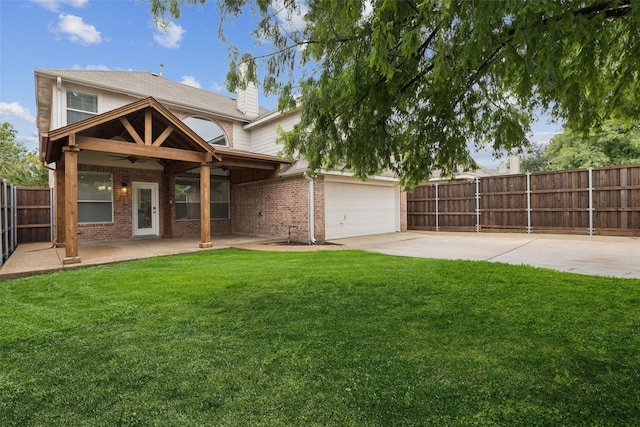 2210 Garden Crest Dr, Rockwall, TX 75087 - back of house with ceiling fan, brick siding, a fenced backyard, and a chimney