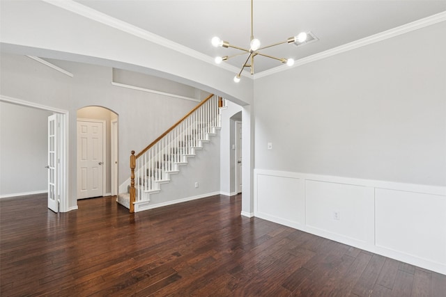2210 Garden Crest Dr, Rockwall, TX 75087 - unfurnished room with arched walkways, a chandelier, stairway, ornamental molding, and hardwood / wood-style floors