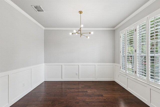 2210 Garden Crest Dr, Rockwall, TX 75087 - empty room with plenty of natural light, a chandelier, crown molding, wood finished floors, and a wainscoted wall
